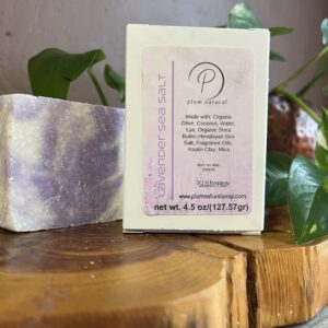 Lavender soap bar on wooden surface.