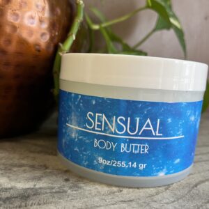 Sensual body butter jar on table.