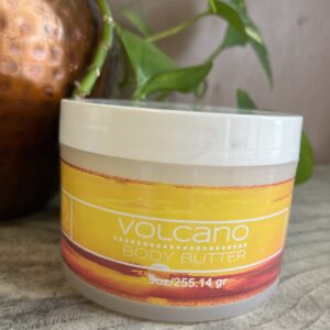Volcano body butter jar on table.